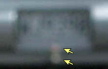 Blurred licence plate showing point sources